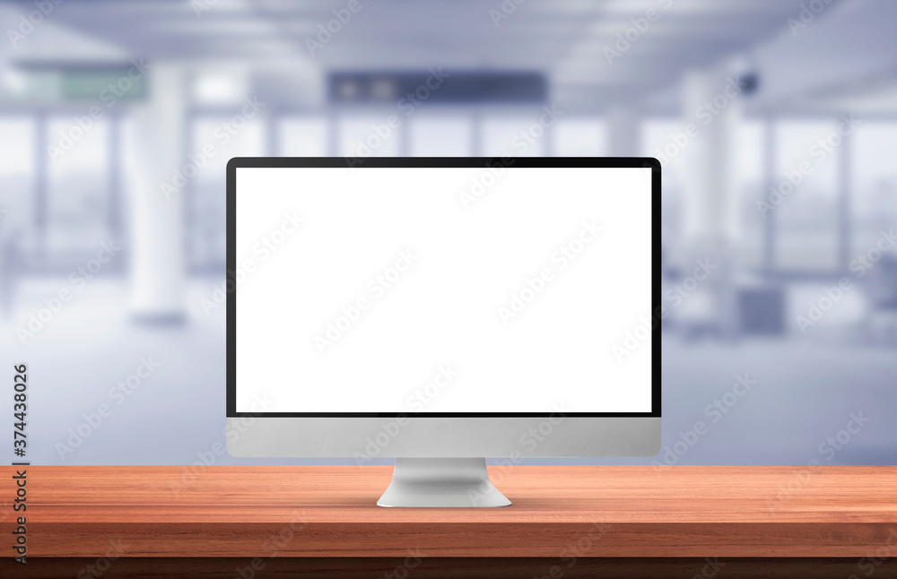 Poster computer monitor with blank screen on wood table in blurry background with airport