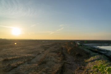 Wooden fence on a field / Sunset on the beach / sunset over the river