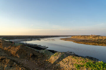 Wooden fence on a field / Sunset on the beach / sunset over the river