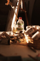 brushes in a glass for oil painting in the artist's studio