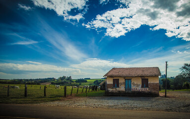 old house in the countryside with blue sky