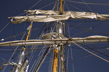 Sailboat's mast, canvas sails andrope  lines