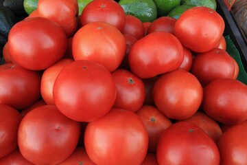 Close up view of fresh red delicious tomatoes