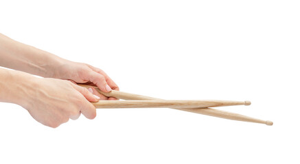 Woman's hands holding drum sticks. Isolated on white.