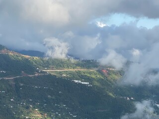 Fototapeta premium view of clouds over hills