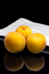 peaches on black background, dark food