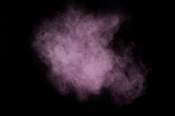 Fototapeta na wymiar Purple powder explosion on black background. Colored powder cloud. Colorful dust explode. Paint Holi.