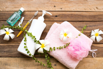 toothbrush ,toothpaste ,mouthwash health care for oral cavity with herbal soap ,terry cloth health care for body skin of lifestyle woman arrangement flat lay style on background wooden