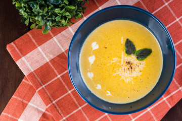 squash soup with cream and roasted Parmesan cheese