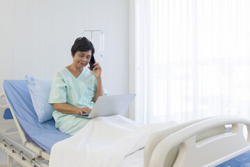 The elderly Asian women sit in bed, recover, talk on the phone, and do errands on laptops, in hospitals, special rooms.