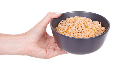 Hand with asian instant noodle in dark bowl, isolated on white background.