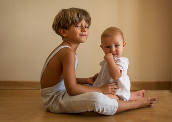 Portrait Of Beautiful Siblings Playing At Home
Portrait of beautiful siblings playing at home. Family concept.