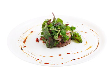 Meat steak with greens and mushrooms on white background
