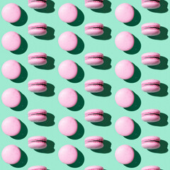 Seamless regular creative pattern of colorful french cookies macarons. Printing on fabric, wrapping paper.