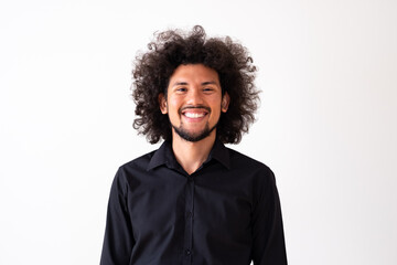 Fototapeta na wymiar Latin American model in black shirt with big curly hair and beard, neutral background 