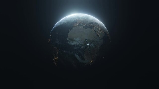 Earth slowly rotating in space, backlit by the sun with the lights of the planet's cities visible on the surface. Spaceship module flying to the earth.