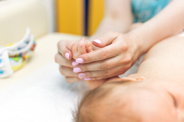 Obraz na płótnie Canvas Baby massage, close up shot. Child massage, newborn.