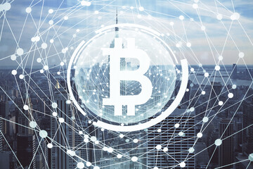 Double exposure of crypto currency theme hologram drawing and city veiw background. Concept of blockchain and bitcoin.