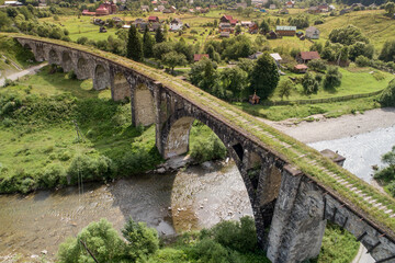 Aerial view of railway viaduct in Vorokhta village, Carpathians mountains, Ukraine