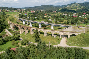 Aerial view of railway viaduct in Vorokhta village, Carpathians mountains, Ukraine