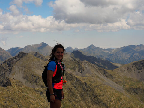 young trail runner woman in comapedrosa mountain Andorra