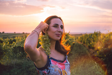 Beautiful woman walking in vineyard in nature. Happy people lifestyle.