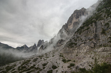 On trail #554 in dense fog before the last stretch to Rifugio Bruto Carestiato, beneath Pala del...