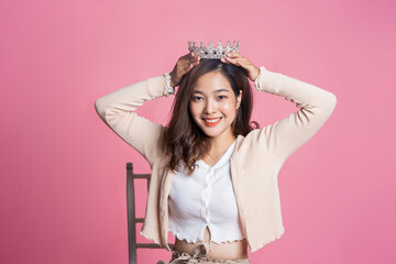 Asian woman beautiful attractive smiling happy confident wearing crown jewelry princess fashionable...