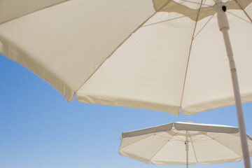 beach umbrellas against the blue sky