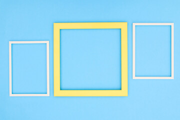 Wooden decorative frame on blue background 