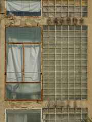 Decadent facade with enclosed balcony and glazed wall. Old city center of Tarragona. Catalonia....