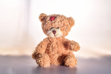 sad teddy bear isolated on white background
