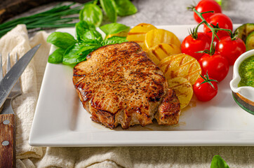 Delicious pork steak with herbs sauce