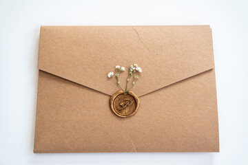 Envelope with wax seal and little dry flowers