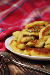 Polish dish kopytka served at the table