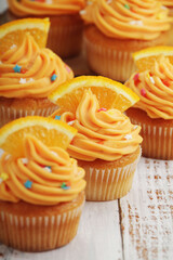 Cupcakes with orange icing on top