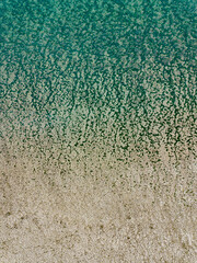 abstract transition from sand to blue water