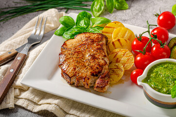 Delicious pork steak with herbs sauce