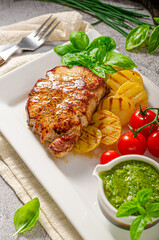 Delicious pork steak with herbs sauce