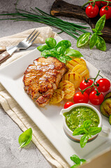 Delicious pork steak with herbs sauce