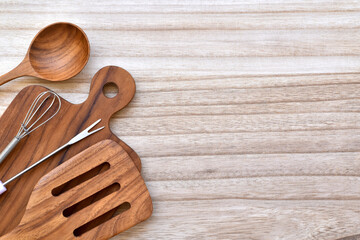 Top view, Kitchen utensils on the side wooden plate.