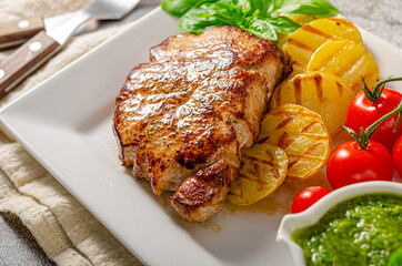 Delicious pork steak with herbs sauce