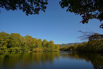 Fototapeta na wymiar Mountain Lake in Early Autumn Sunlight, Nagano, Japan