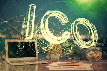 Double exposure of blockchain theme hologram and table with computer background. Concept of bitcoin crypto currency.