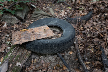 Obraz premium old used tyres illegal disposed in nature