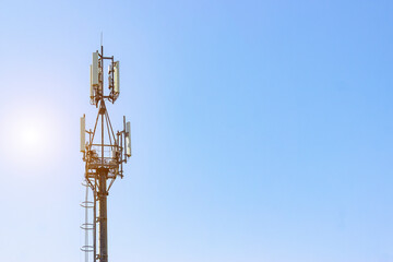 Telecommunications equipment -  the cellular antenna. Signal Tower for Mobile telecommunication system on the blue sky background. Concept for Wireless communication.