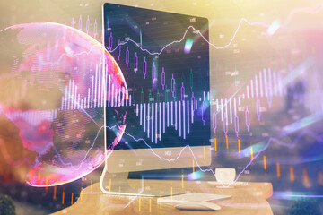 Double exposure of chart and financial info and work space with computer background. Concept of international online trading.