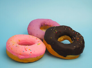 pink, purple and chocolate donut with sprinkles , Colorful Doughnut dessert food 