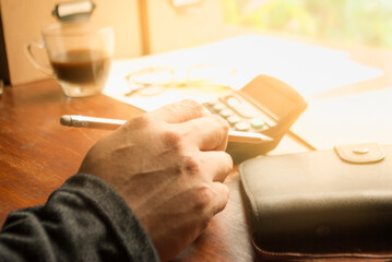 Financial accounting, money calculator on table