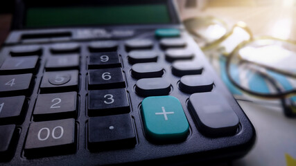 Fototapeta na wymiar Financial accounting, money calculator on table